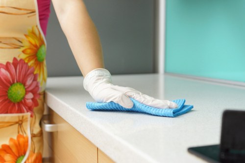 Professional cleaner arranging a property handover clean in a busy West London street