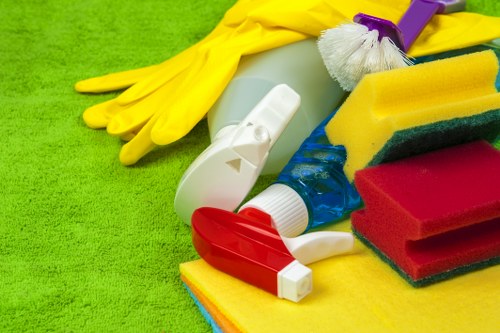 Local cleaning team working on bathroom and appliance details during a move-out clean